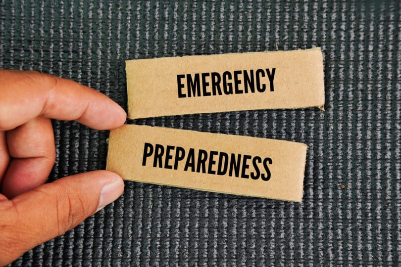 Boxed paper with the words Emergency Preparedness. creating a plan and gathering supplies to stay safe during a disaster. refers to the Emergency Management cycle or the concept of preparedness