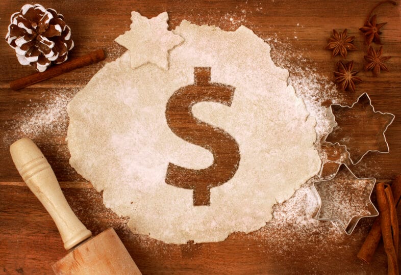 Festive cookie dough with the shape of a Dollar symbol cut out (series)